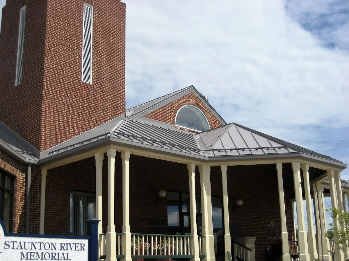 Skilled roofing craftsmen working on a residential roof in Alexandria